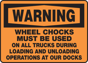 Accuform MTKC303XT 10" x 14" OSHA Warning Safety Sign: Wheel Chocks Must Be Used On All Trucks During Loading and Unloading Operations At Our Docks