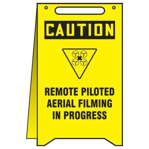 Accuform PFR608 20"" x 12"" OSHA Caution Fold-Up Floor Sign: Remote Piloted Aerial Filming in Progress